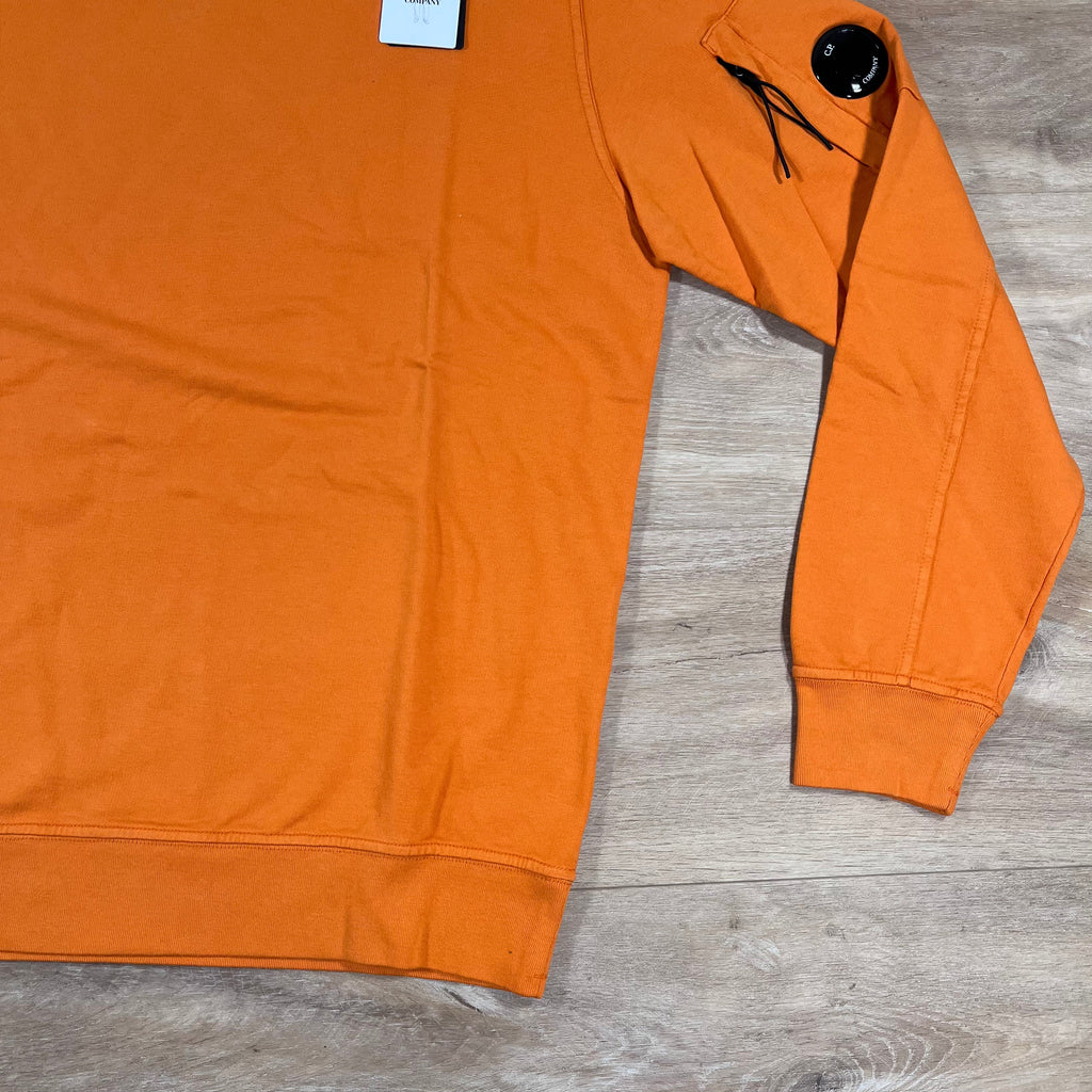 CP Company Light Fleece Crewneck Lens Sweatshirt in Russet Orange -Usfansport