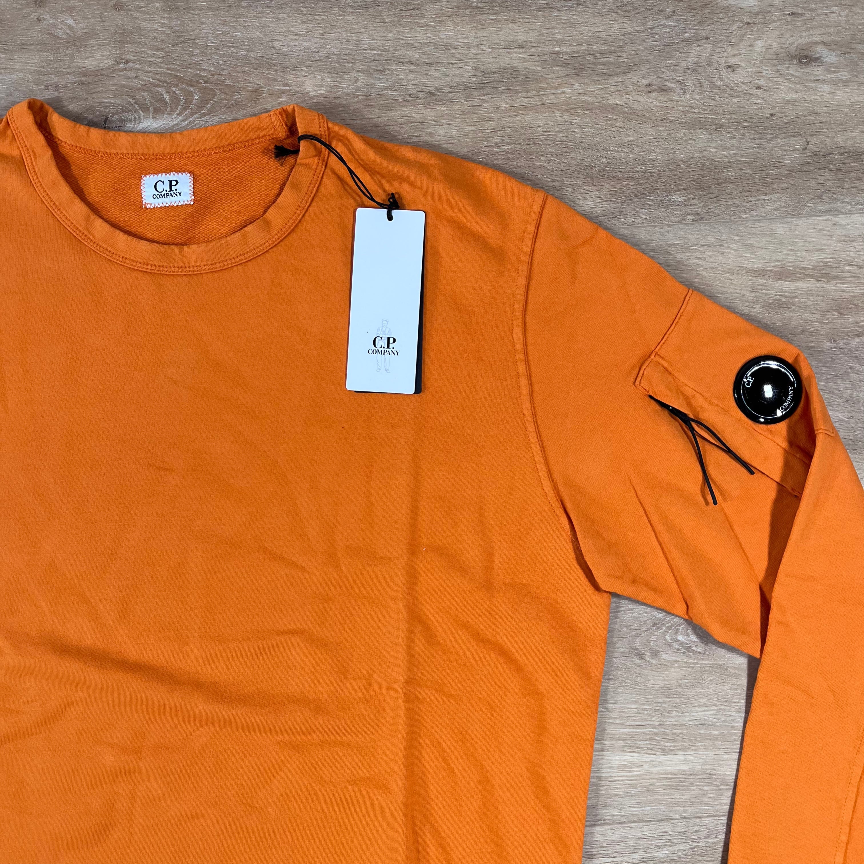 CP Company Light Fleece Crewneck Lens Sweatshirt in Russet Orange -Usfansport