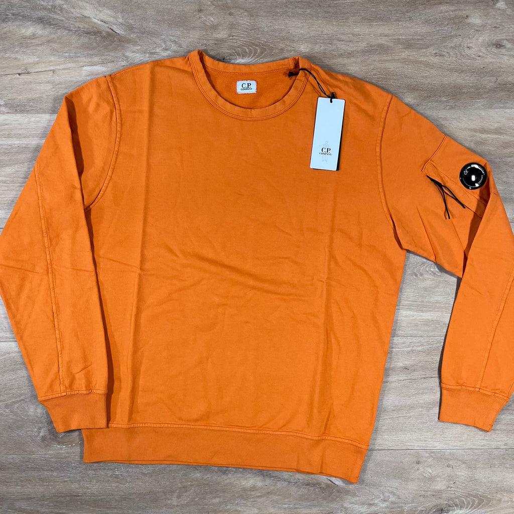 CP Company Light Fleece Crewneck Lens Sweatshirt in Russet Orange -Usfansport